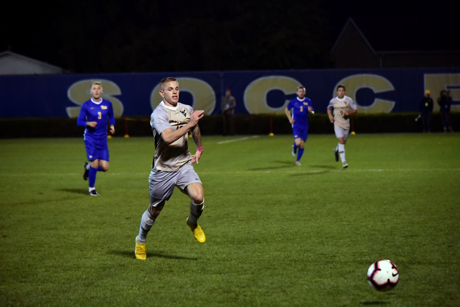Senior Midfielder Joey Piatczyc races to get to the ball before it goes out of bounds